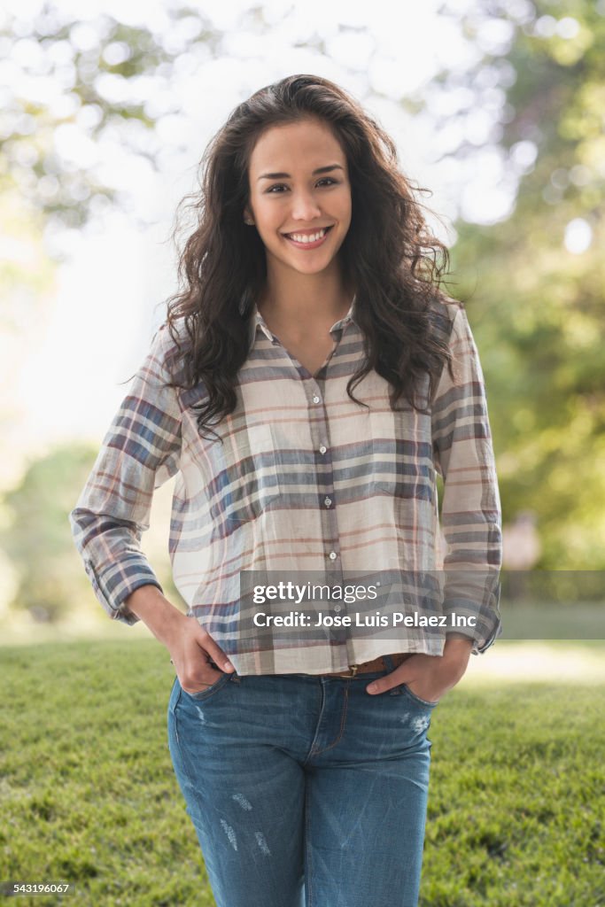 Mixed race woman smiling in park