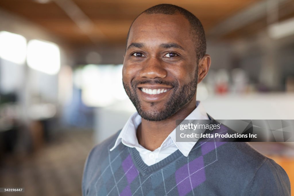 African American businessman smiling in office