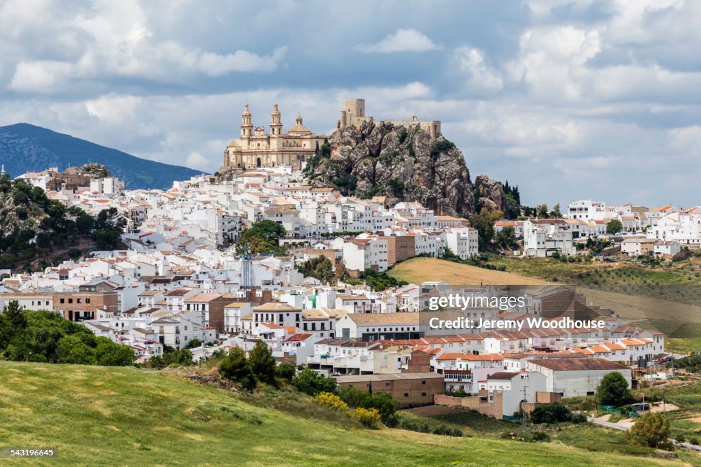 Hilltop church overlooking Olvera cityscape, Andalusia, Spain