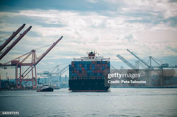 tugboat and container ship in industrial harbor - barge stock pictures, royalty-free photos & images