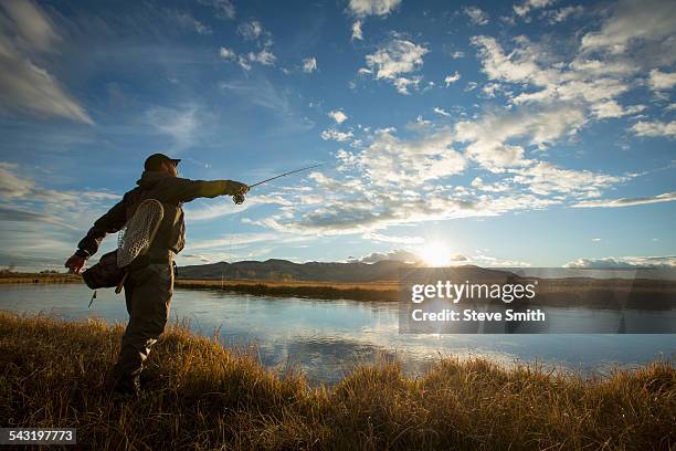 fisherman casting in river - ketchum idaho stock pictures, royalty-free photos & images