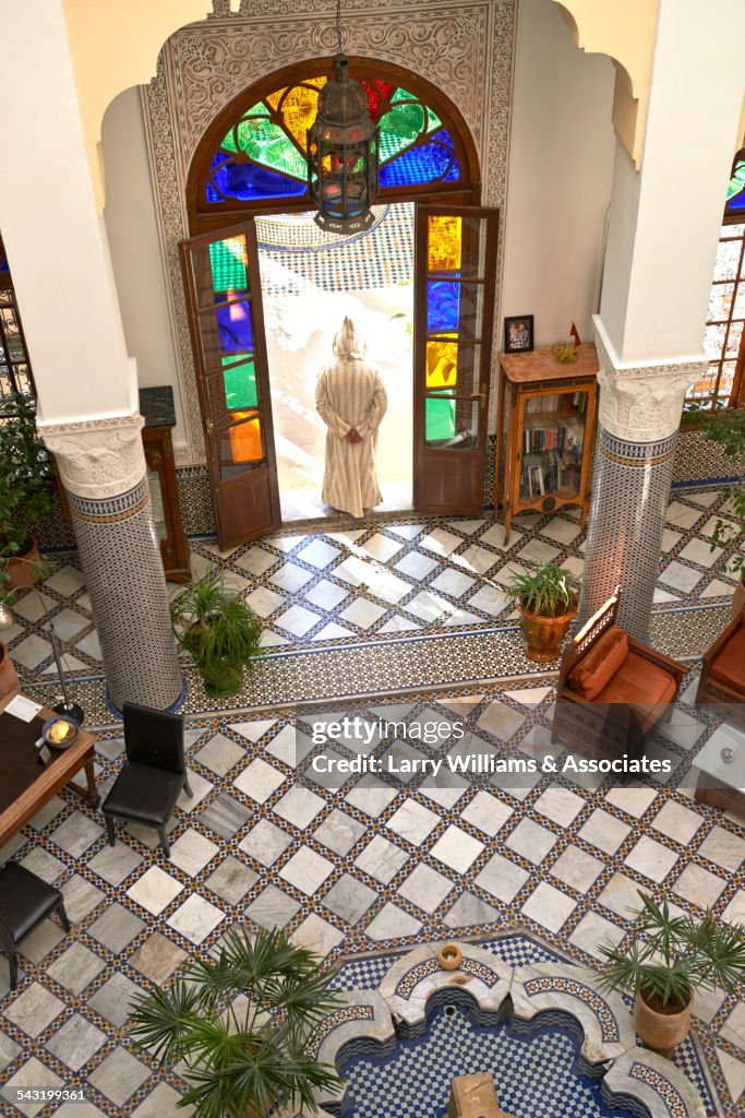 High angle view of Caucasian man in ornate doorway