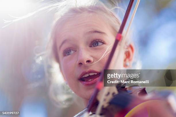 close up of caucasian girl playing violin - southwest music stock pictures, royalty-free photos & images