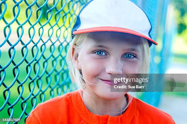 portrait of young girl wearing baseball kit - girl baseball cap stock pictures, royalty-free photos & images