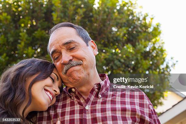 Father and daughter sharing tender moment