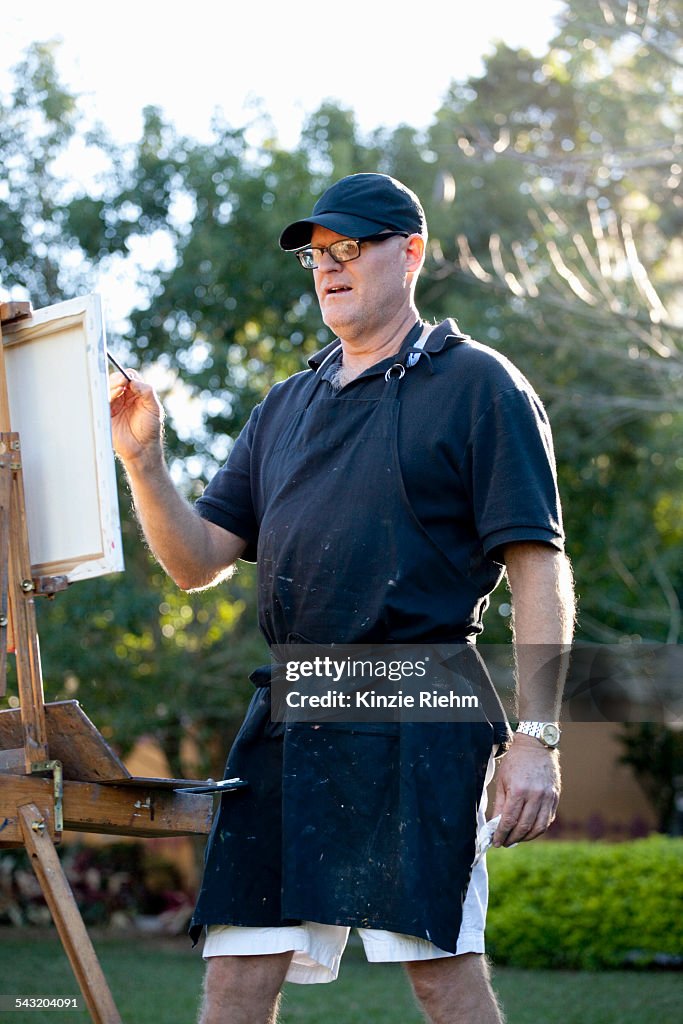 Male plein-air painter in Albin Polasek Museum and Sculpture Garden, Winter Park, Florida, USA