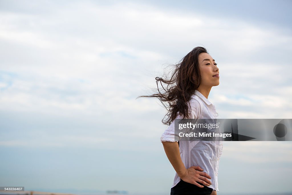 A woman on a beach in Kobe.