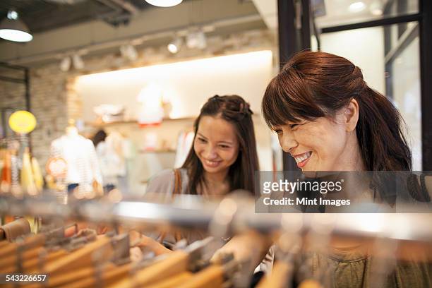 mother and daughter on a shopping trip. - japanese mother daughter stock pictures, royalty-free photos & images