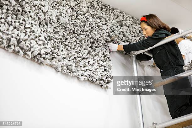 an artist at work in a studio. - installation art stock pictures, royalty-free photos & images