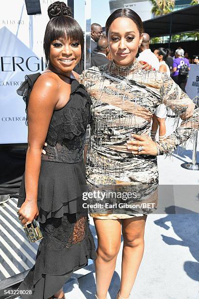 Actresses Naturi Naughton and Tia Mowry-Hardrict attend the Cover Girl glam stage during the 2016 BET Awards at the Microsoft Theater on June 26,...