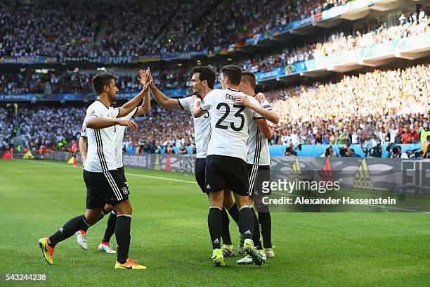 Julian Draxler of Germany celebrates scoring his team's third goal with his team mates during the UEFA EURO 2016 round of 16 match between Germany...