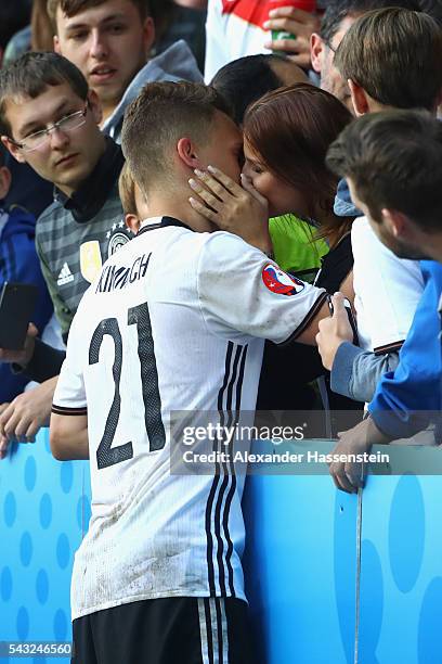 Joshua Kimmich of Germany kisses his girlfriend Lina Meyer after the UEFA EURO 2016 round of 16 match between Germany and Slovakia at Stade...