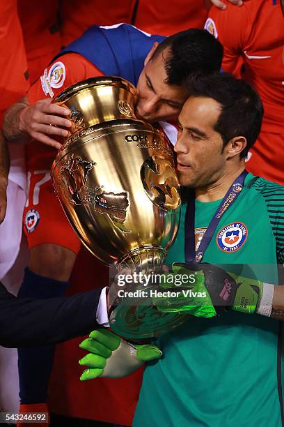 Gary Medel and Claudio Bravo of Chile celebrate with the trophy after winning the championship match between Argentina and Chile at MetLife Stadium...