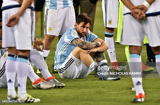 Argentina's Lionel Messi waits to receive the second place medal during the Copa America Centenario awards ceremony in East Rutherford, New Jersey,...