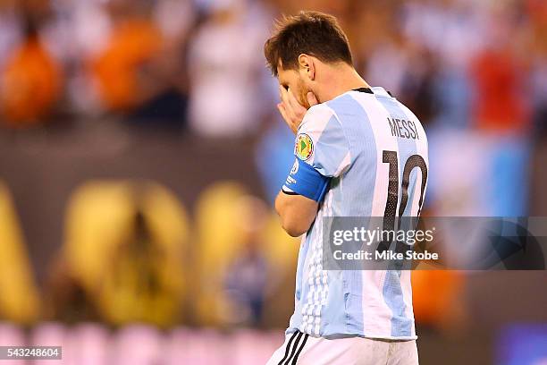 Lionel Messi of Argentina reacts after missing a penalty kick against Chile during the Copa America Centenario Championship match at MetLife Stadium...