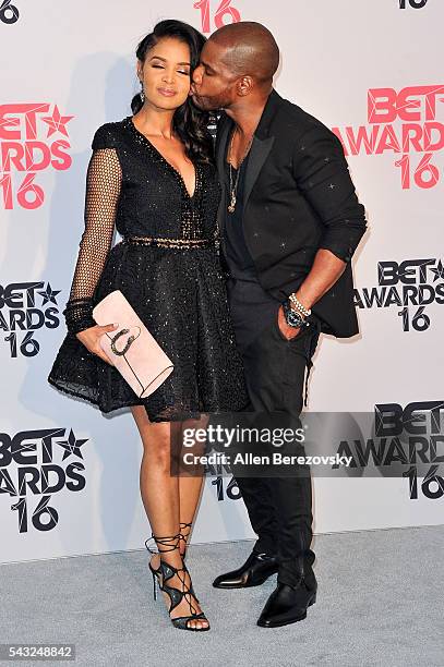 Recording artist Kirk Franklin and wife Tammy Collins pose for pictures in the press room during the 2016 BET Awards at Microsoft Theater on June 26,...