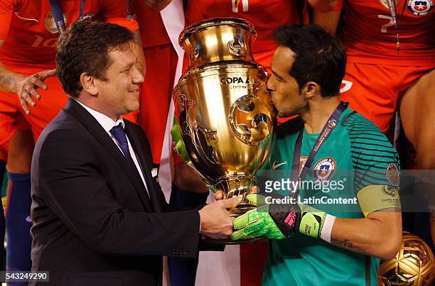 Claudio Bravo of Chile kisses the Copa America Centenario Trophy as he receives it following the championship match between Argentina and Chile at...