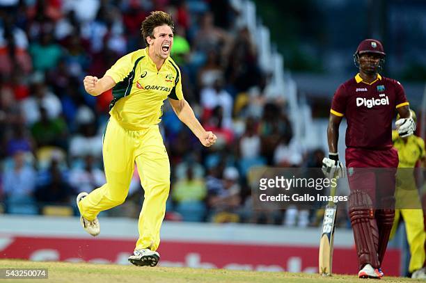 Mitchell Marsh of Australia celebrates the wicket of Darren Bravo of the West Indies during the Tri-Nation Series One-day International Final between...