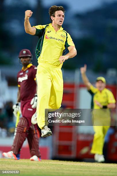 Mitchell Marsh of Australia celebrates the wicket of Darren Bravo of the West Indies during the Tri-Nation Series One-day International Final between...