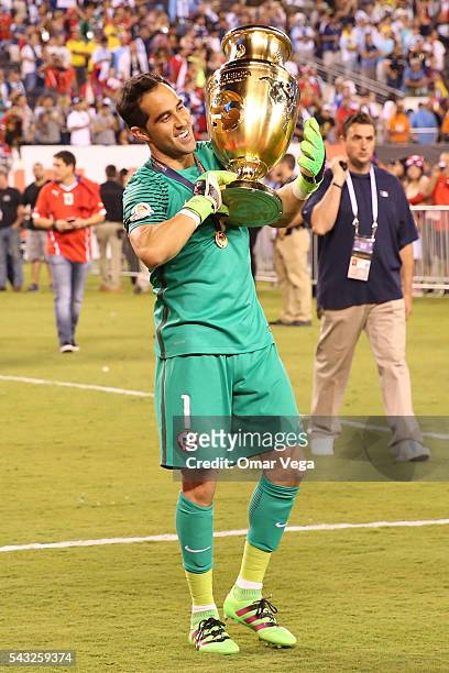 Claudio Bravo of Chile celebrates with the trophy after winning the championship match between Argentina and Chile at MetLife Stadium as part of Copa...