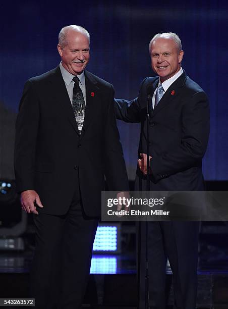 Gordie Howe's sons Marty Howe and Mark Howe speak during the In Memoriam portion of the 2016 NHL Awards at The Joint inside the Hard Rock Hotel &...