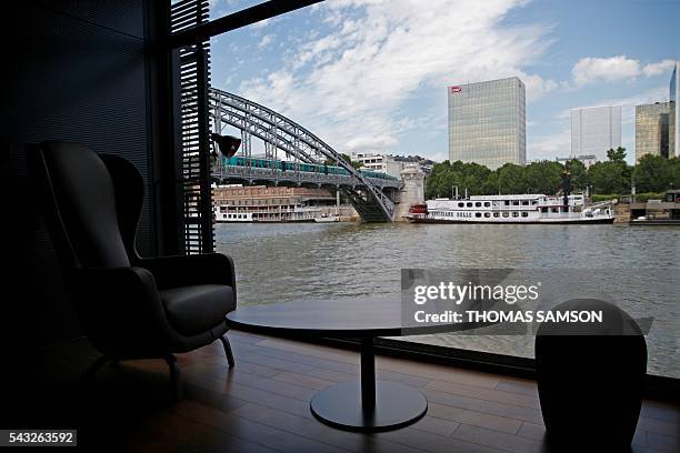 Picture taken on June 23, 2016 shows the Off-Paris Seine floating hotel is pictured on the river Seine in Paris. The Off-Paris Seine hotel, which was...