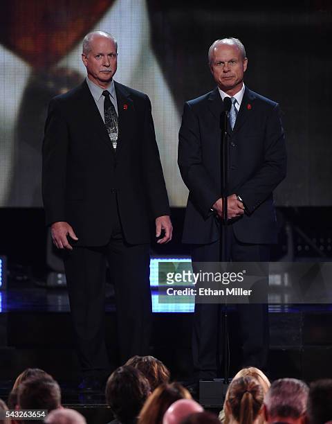 Gordie Howe's sons Marty Howe and Mark Howe speak during the In Memoriam portion of the 2016 NHL Awards at The Joint inside the Hard Rock Hotel &...