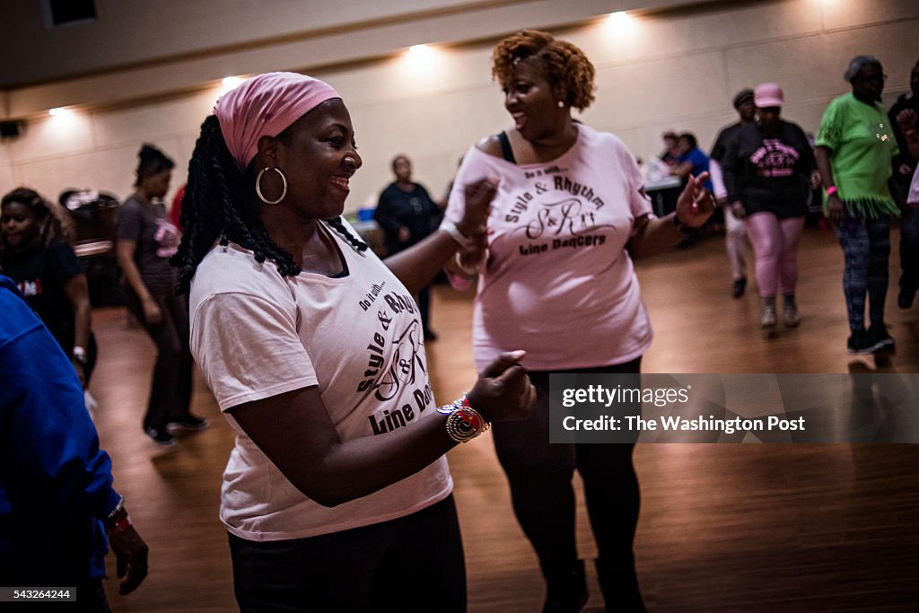 Emel Lyons, left, dances at a soul line dancing night in Jessup, Maryland