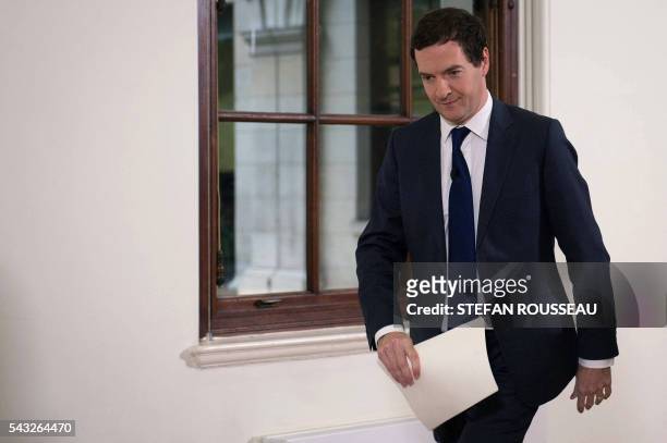 British Chancellor of the Exchequer George Osborne leaves after making a statement at the Treasury in London on June 27 following the pro-Brexit...