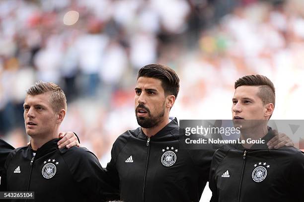 Toni Kroos, Sami Khedira and Julian Draxler of Germany during the European Championship match Round of 16 between Germany and Slovakia at Stade...