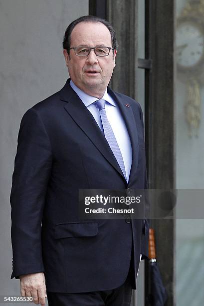 French President Francois Hollande stands prior to a meeting with Bill Gates, the co-Founder of the Microsoft company and co-Founder of the Bill and...