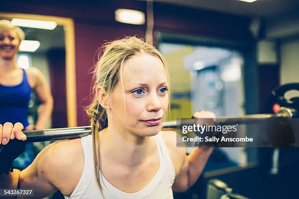 woman exercising in the gym - barbell stock pictures, royalty-free photos & images