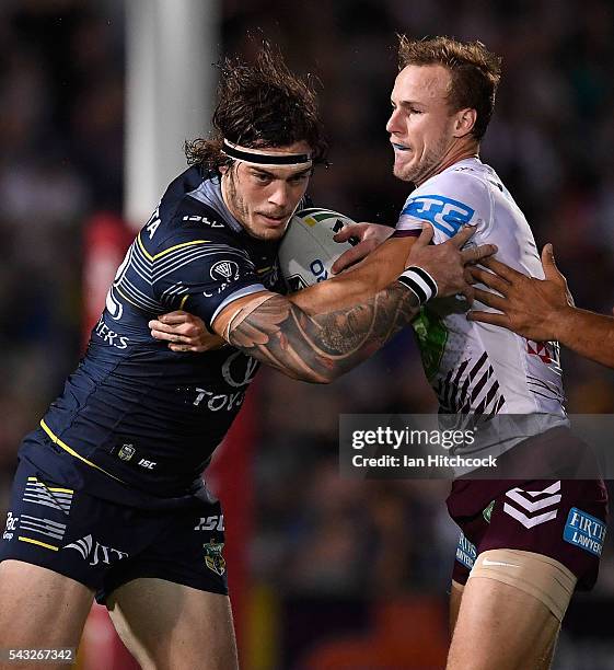 Ethan Lowe of the Cowboys is tackled by Daly Cherry-Evans of the Sea Eagles during the round 16 NRL match between the North Queensland Cowboys and...
