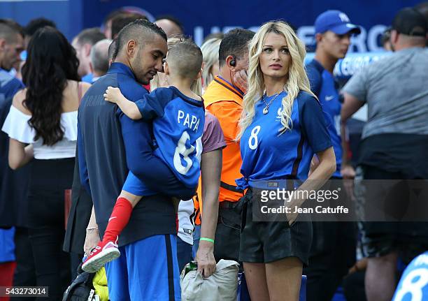 Dimitri Payet of France meets his wife Ludivine Payet and his younger son Noa Payet following the UEFA EURO 2016 round of 16 match between France and...
