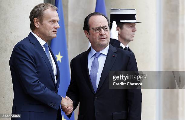 French President Francois Hollande welcomes President of the European Council Donald Tusk prior to attend a meeting at the Elysee Presidential Palace...
