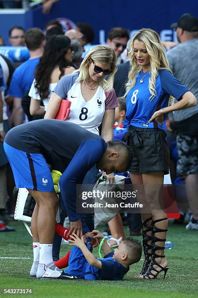 Dimitri Payet of France meets his wife Ludivine Payet and his younger son Noa Payet following the UEFA EURO 2016 round of 16 match between France and...