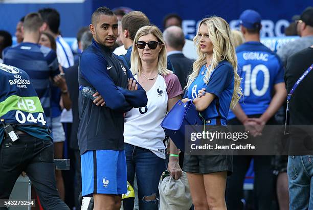 Dimitri Payet of France meets his wife Ludivine Payet following the UEFA EURO 2016 round of 16 match between France and Republic of Ireland at Stade...