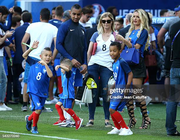 Dimitri Payet of France meets his wife Ludivine Payet and their sons Milan Payet and Noa Payet following the UEFA EURO 2016 round of 16 match between...