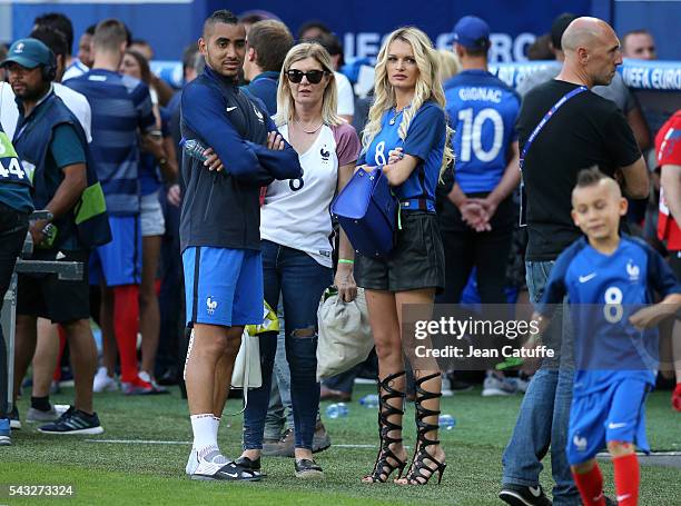 Dimitri Payet of France meets his wife Ludivine Payet following the UEFA EURO 2016 round of 16 match between France and Republic of Ireland at Stade...