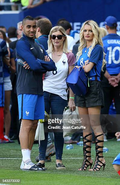 Dimitri Payet of France meets his wife Ludivine Payet following the UEFA EURO 2016 round of 16 match between France and Republic of Ireland at Stade...