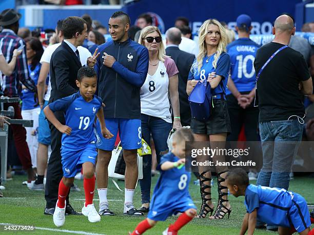 Dimitri Payet of France meets his wife Ludivine Payet and their sons Milan Payet and Noa Payet following the UEFA EURO 2016 round of 16 match between...