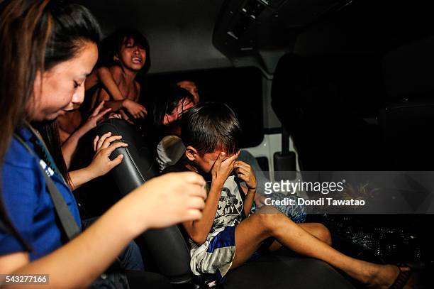 Social workers and police round up minors at night during curfew on June 8, 2016 in Manila, Philippines. The president-elect of the Philippines,...