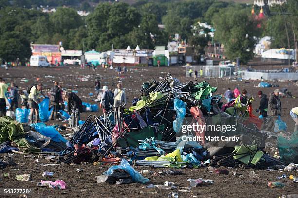 Litter pickers begin the job of clearing the fields in front of the main Pyramid Stage at the Glastonbury Festival 2016 at Worthy Farm, Pilton on...