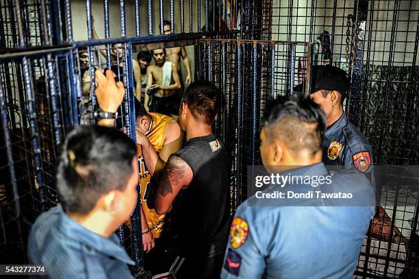 Drug suspects are led into a crowded jail cell on June 20, 2016 in Manila, Philippines. The president-elect of the Philippines, Rodrigo Duterte,...