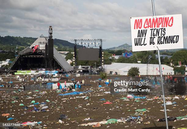 Litter pickers begin the job of clearing the fields in front of the main Pyramid Stage at the Glastonbury Festival 2016 at Worthy Farm, Pilton on...