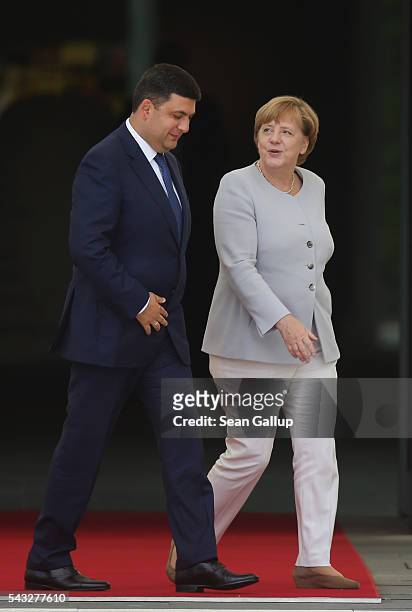 German Chancellor Angela Merkel and Ukrainian Prime Minister Volodymyr Groysman chat upon Groysman's arrival at the Chancellery on June 27, 2016 in...