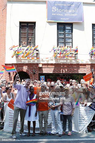 Bill de Blasio, Chirlane McCray, Al Sharpton, Cynthia Nixon, Max Ellington Nixon-Marinoni, and Christine Marinoni participate in the 2016 Pride March...