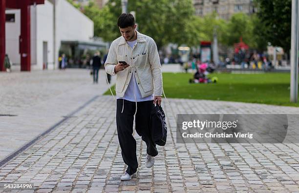 Guest outside Off White during the Paris Fashion Week Menswear Spring/Summer 2017 on June 26, 2016 in Paris, France.