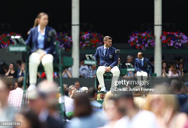 Umpires look on during day one of the Wimbledon Lawn Tennis Championships at the All England Lawn Tennis and Croquet Club on June 27th, 2016 in...