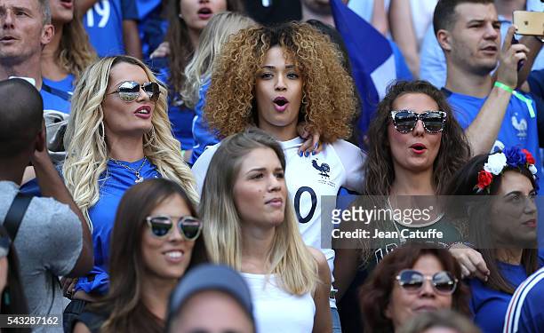 Ludivine Payet, wife of Dimitri Payet, Sephora Coman, wife of Kingsley Coman and Tiziri Digne, wife of Lucas Digne sing 'la Marseillaise' before the...